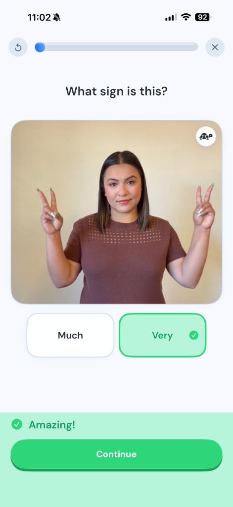 A Ziggy lesson asking which sign is shown, with a real signer and answer choices